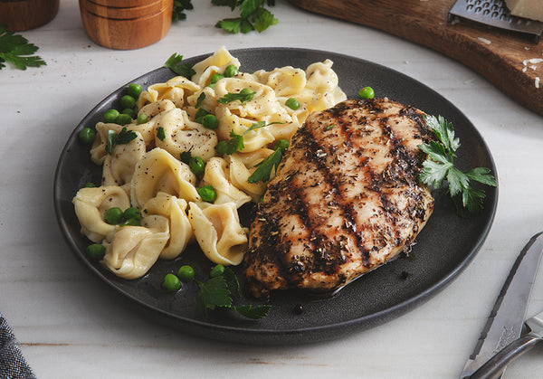 Grilled Italian Chicken & Four Cheese Tortellini with Garlic Butter Sauce and Spring Peas
