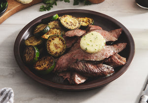 Sliced Flank Steak with Herb Compound Butter & Balsamic Roasted Zucchini
