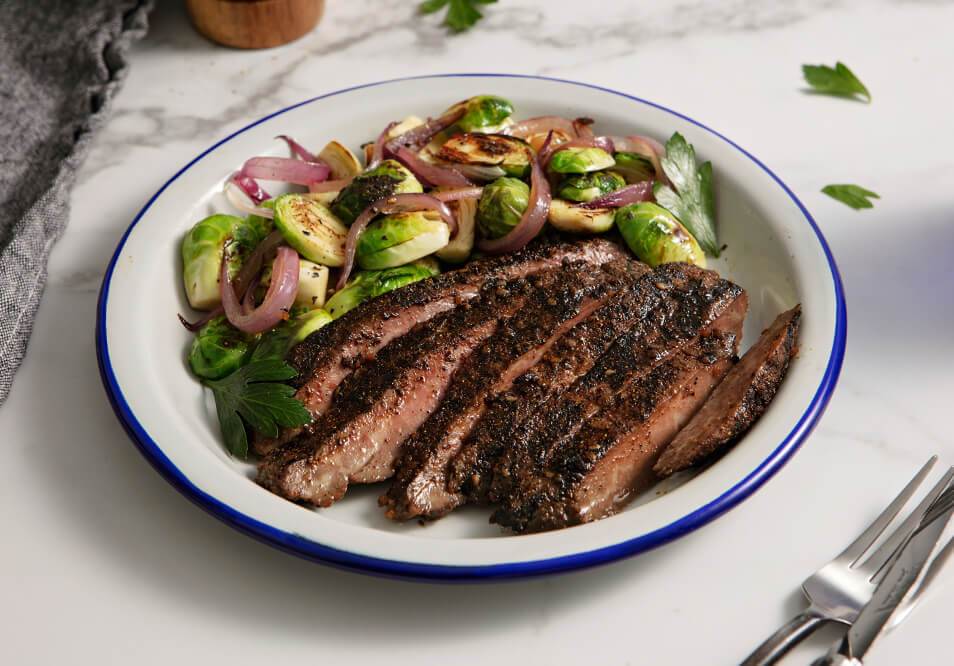 Coffee Rubbed Steak with Brussels Sprouts and Caramelized Onions