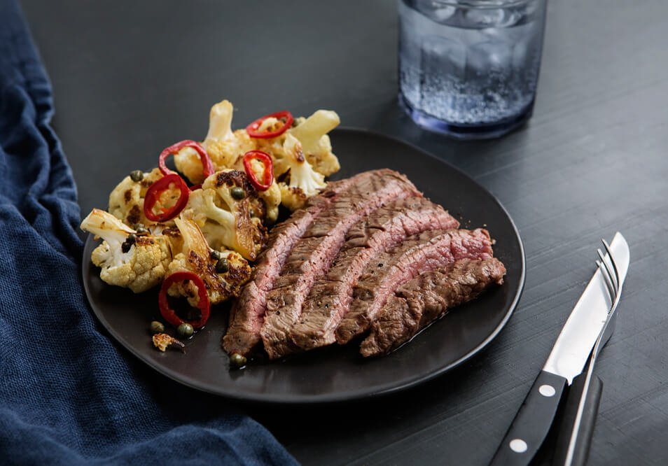Grass-Fed Flank Steak with Roasted Cauliflower, Capers and Chilies