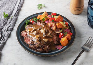 Grass-Fed Flank Steak with Mushroom Cream Sauce and Balsamic Roasted Root Vegetables