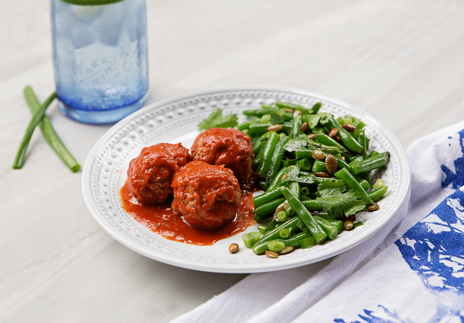 Grass-Fed Beef Meatballs in Roasted Red Chili Tomato Sauce with Green Beans and Pepitas