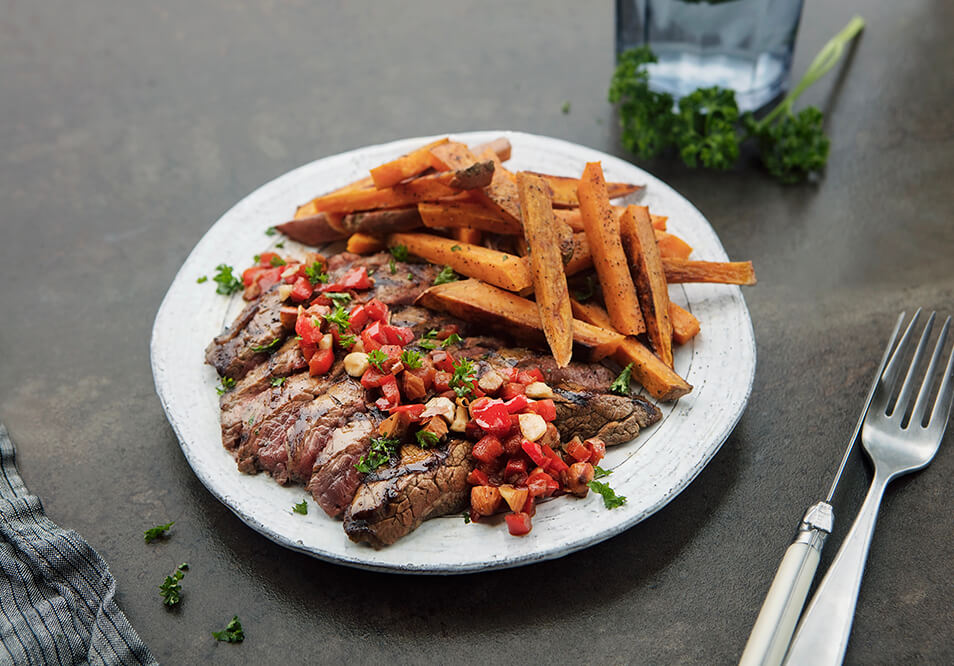 Grilled Grass-Fed Flank Steak with Romesco Salsa and Sweet Potato Fries