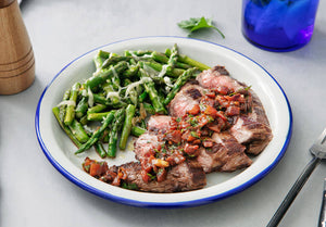 Lemon-Herb Grass-Fed Flank Steak with Charred Tomato Salsa and Asiago Asparagus