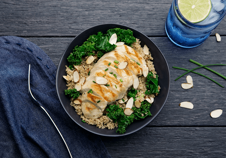 Quinoa and Kale Power Bowl with Grilled Chicken and Sliced Almonds