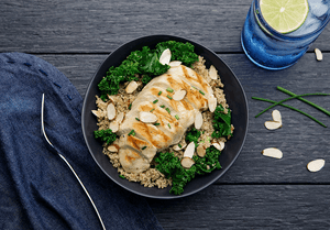 Quinoa and Kale Power Bowl with Grilled Chicken and Sliced Almonds