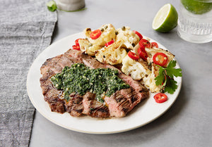 Grilled Grass-Fed Flank Steak with Salsa Verde, Roasted Cauliflower, Capers and Chilies