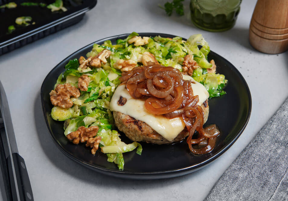 Organic Grilled Swiss Turkey Burger with Caramelized Onions and Brown Butter-Thyme Brussels Sprouts and Walnuts