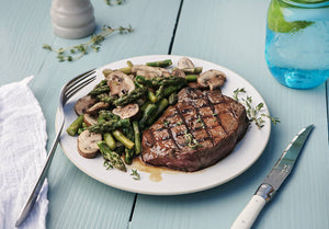 Grilled Grass-Fed Top Steak with Cremini Mushrooms and Asparagus Saute